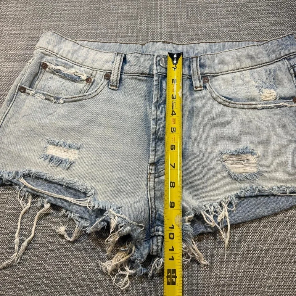 BDG Distressed blue denim shorts with frayed hem